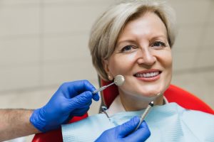 woman in dental chair smiling