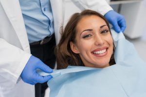 smiling woman in dental chair